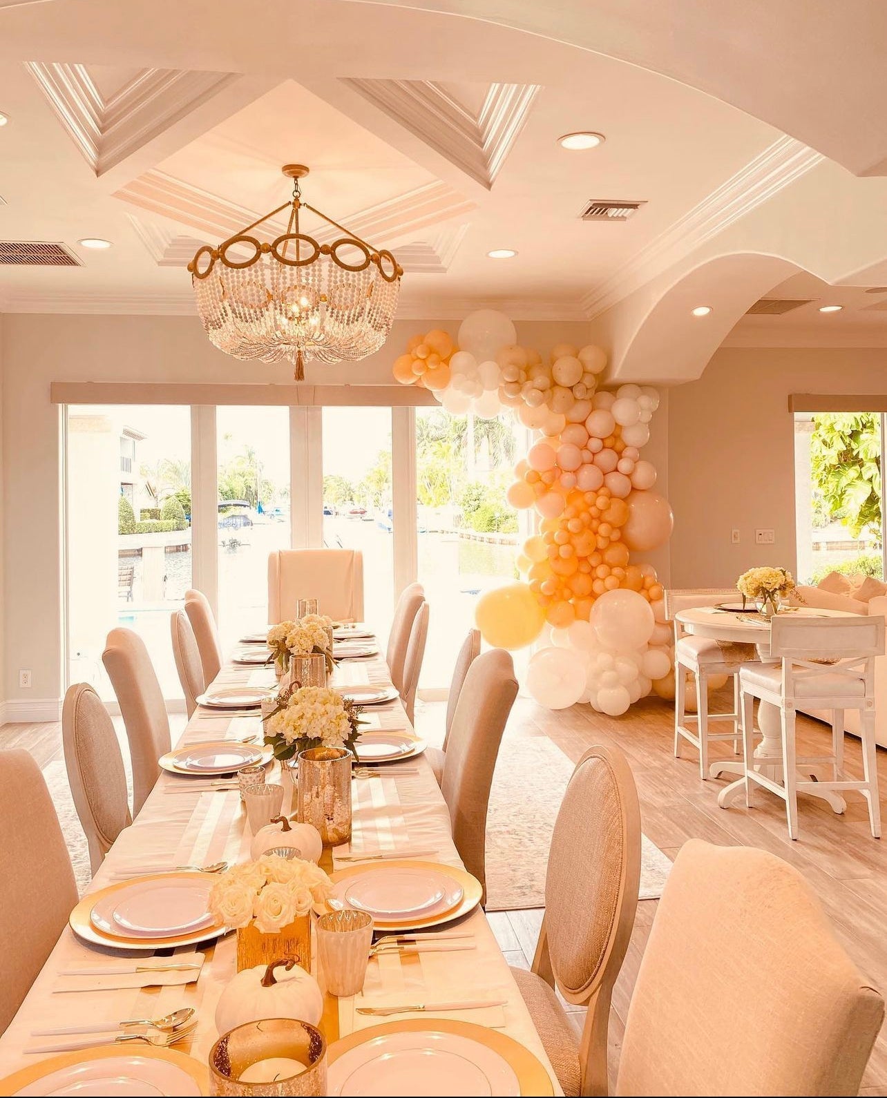 Cream and gold balloon garland elegant table decor for celebration from Parte Haus party supply store in Bethesda MD