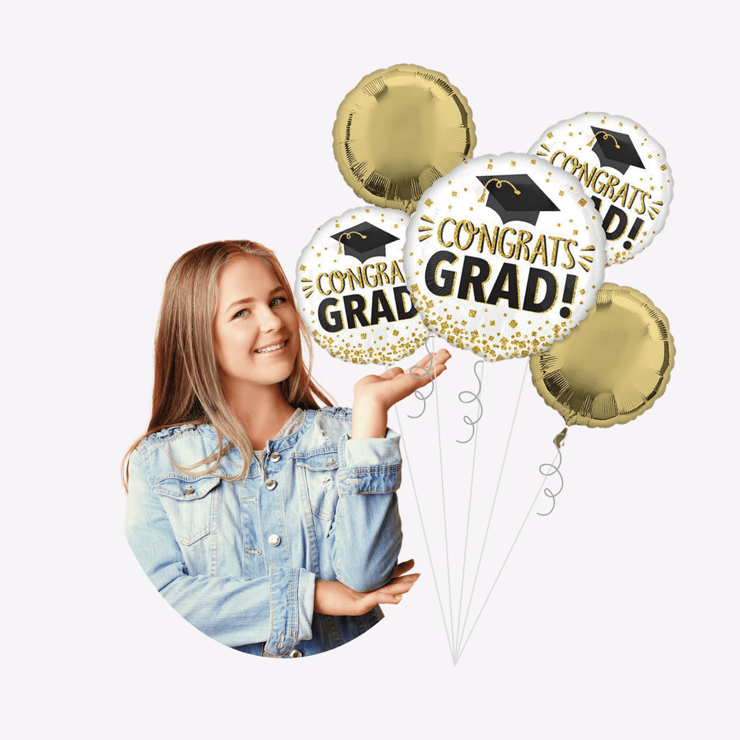 Gold and white graduation balloons with Congrats Grad text held by a smiling teen from Parte Haus party supply store in Bethesda Maryland