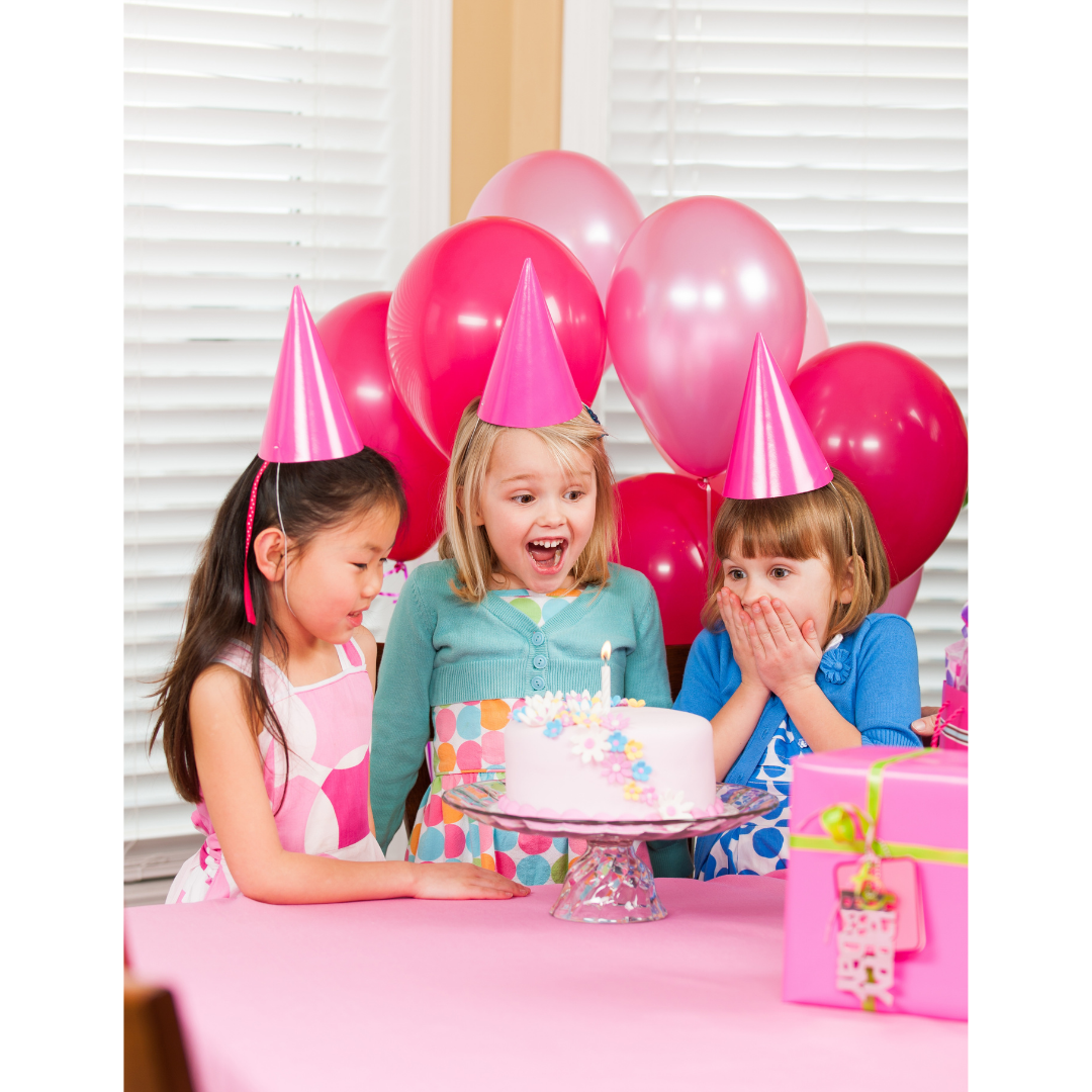 Purple and pink balloon decorations with smiling girls birthday celebration from Parte Haus party supply store in Bethesda MD