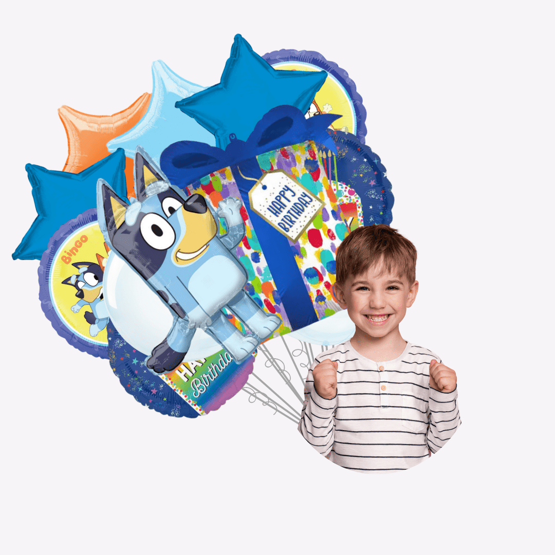 Blue yellow and orange kids birthday balloons with cartoon designs and smiling boy for birthday from Parte Haus party supply store in Bethesda MD