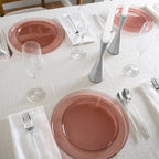 Rose gold dinner plates and clear glasses on an elegant table setting from Parte Haus party supply store in Bethesda MD