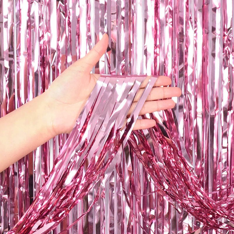 Pink metallic fringe backdrop with shiny tinsel for birthday from Parte Haus party supply store in Bethesda MD