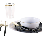 Black and gold dinnerware place setting for formal celebrations from Parte Haus party supply store in Bethesda MD