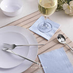 Light blue napkins elegant table setting for celebration from Parte Haus party supply store in Bethesda Maryland