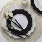 Black and gold cutlery set with marble plates elegant table setting for celebration from Parte Haus party supply store in Bethesda Maryland