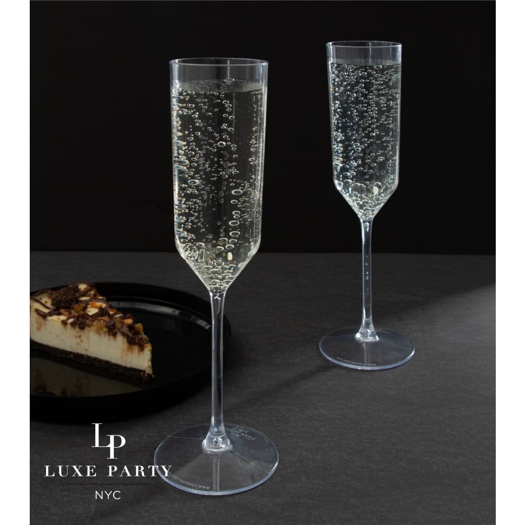 Clear plastic champagne flutes with bubbly drink celebration theme from Parte Haus party supply store in Bethesda MD.
