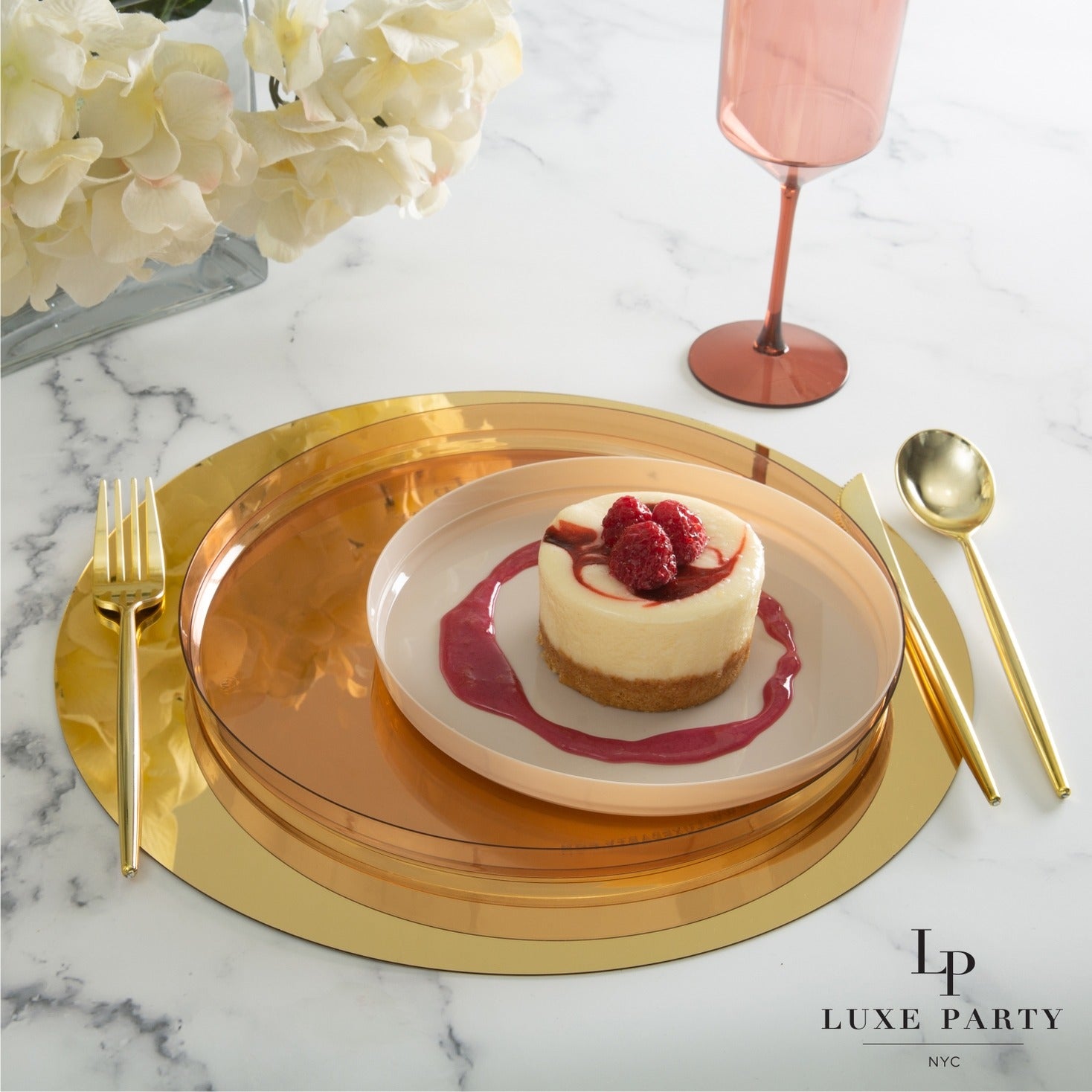 Gold charger plate and flatware set with cheesecake on a pink plate for elegant events from Parte Haus party supply store in Bethesda Maryland