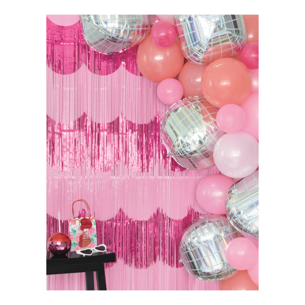 Pink and silver balloon garland with pink fringe backdrop birthday theme from Parte Haus party supply store in Bethesda MD