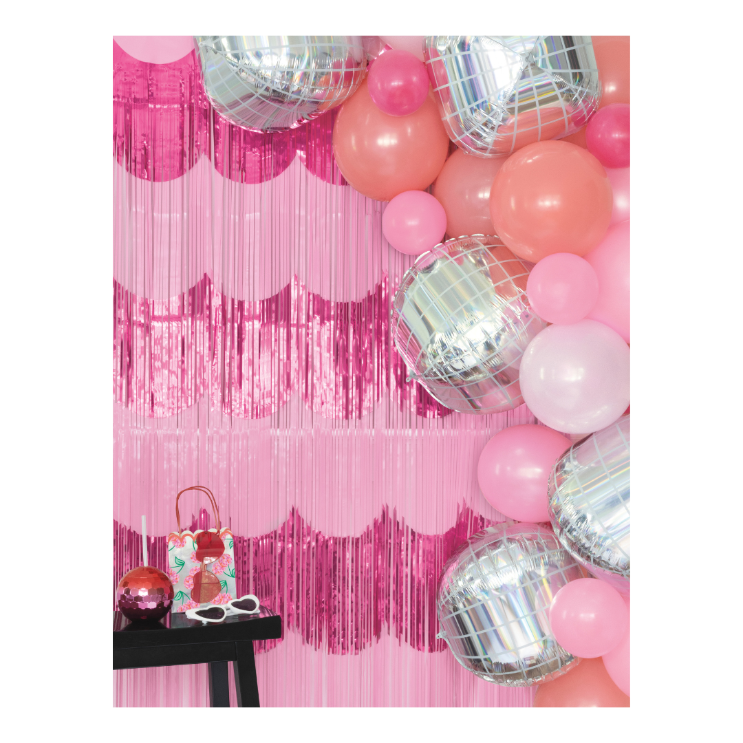 Pink and silver balloon garland with pink fringe backdrop birthday theme from Parte Haus party supply store in Bethesda MD