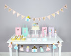 Pastel princess birthday decorations with crowns cupcakes and goodie bags from Parte Haus party supply store in Bethesda Maryland