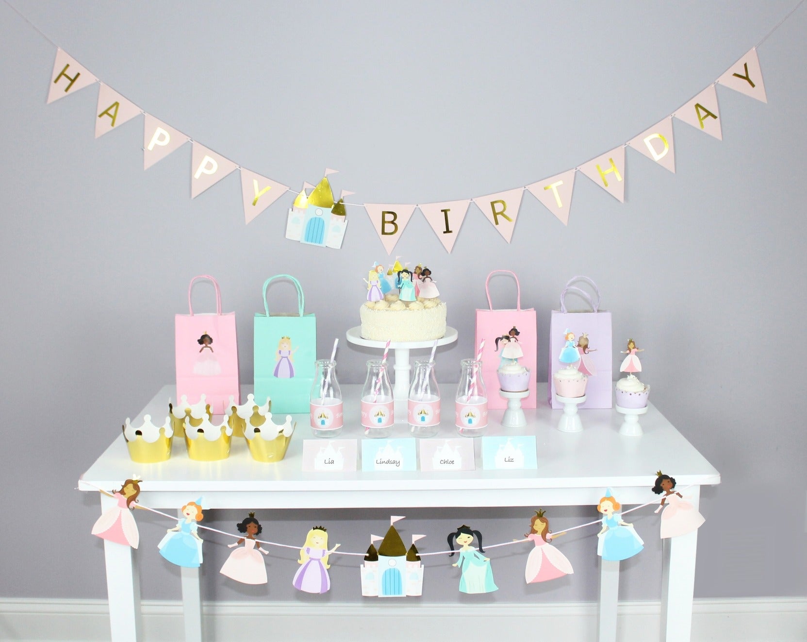 Pastel princess birthday decorations with crowns cupcakes and goodie bags from Parte Haus party supply store in Bethesda Maryland