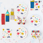 Colorful superhero comic themed plates cups and cookies for kids birthday from Parte Haus party supply store in Bethesda MD