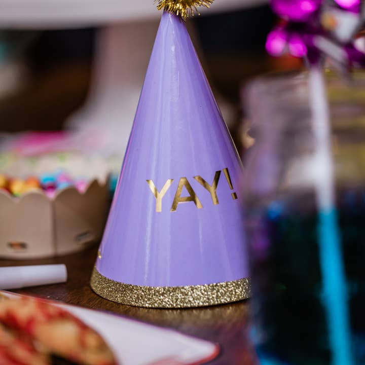 Purple party hat with gold YAY lettering for birthday celebration from Parte Haus party supply store in Bethesda MD.