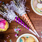 Purple and pink striped party horn blowers with gold accents for birthday celebration from Parte Haus party supply store in Bethesda MD