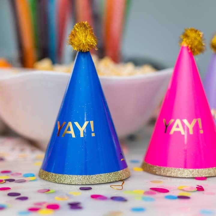 Blue and pink party hats with gold trim for birthday celebration from Parte Haus party supply store in Bethesda MD
