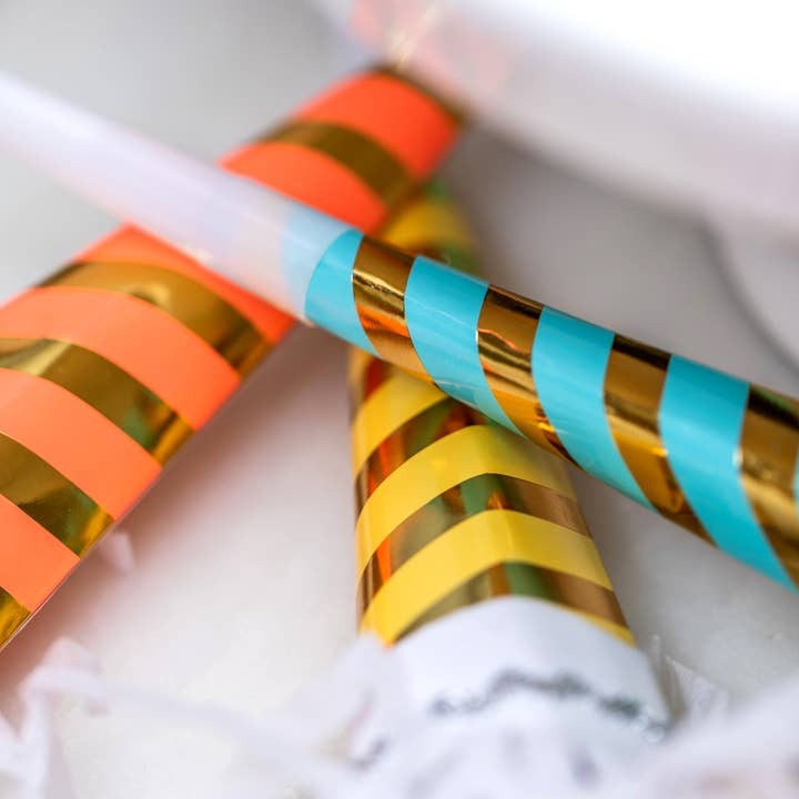 Yellow blue orange striped party horns for birthday celebration from Parte Haus party supply store in Bethesda MD