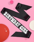 Black birthday girl sash with bold silver letters for birthday celebration from Parte Haus party supply store in Bethesda MD