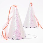 Iridescent pink party hats with pink ribbons birthday celebration from Parte Haus party supply store in Bethesda MD