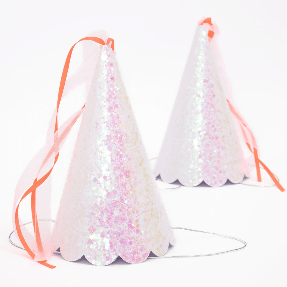 Iridescent pink party hats with pink ribbons birthday celebration from Parte Haus party supply store in Bethesda MD