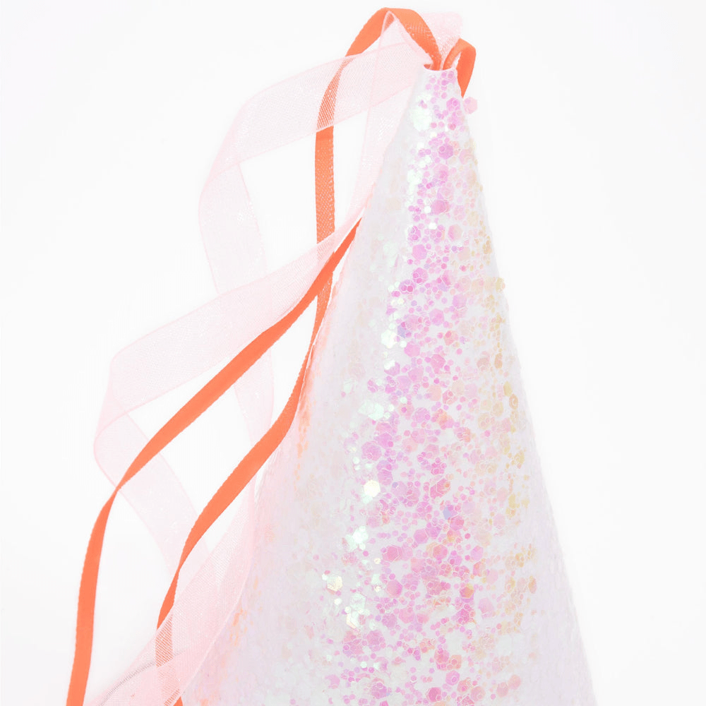 Pink glitter cone hat with orange and pink ribbon birthday from Parte Haus party supply store in Bethesda Maryland