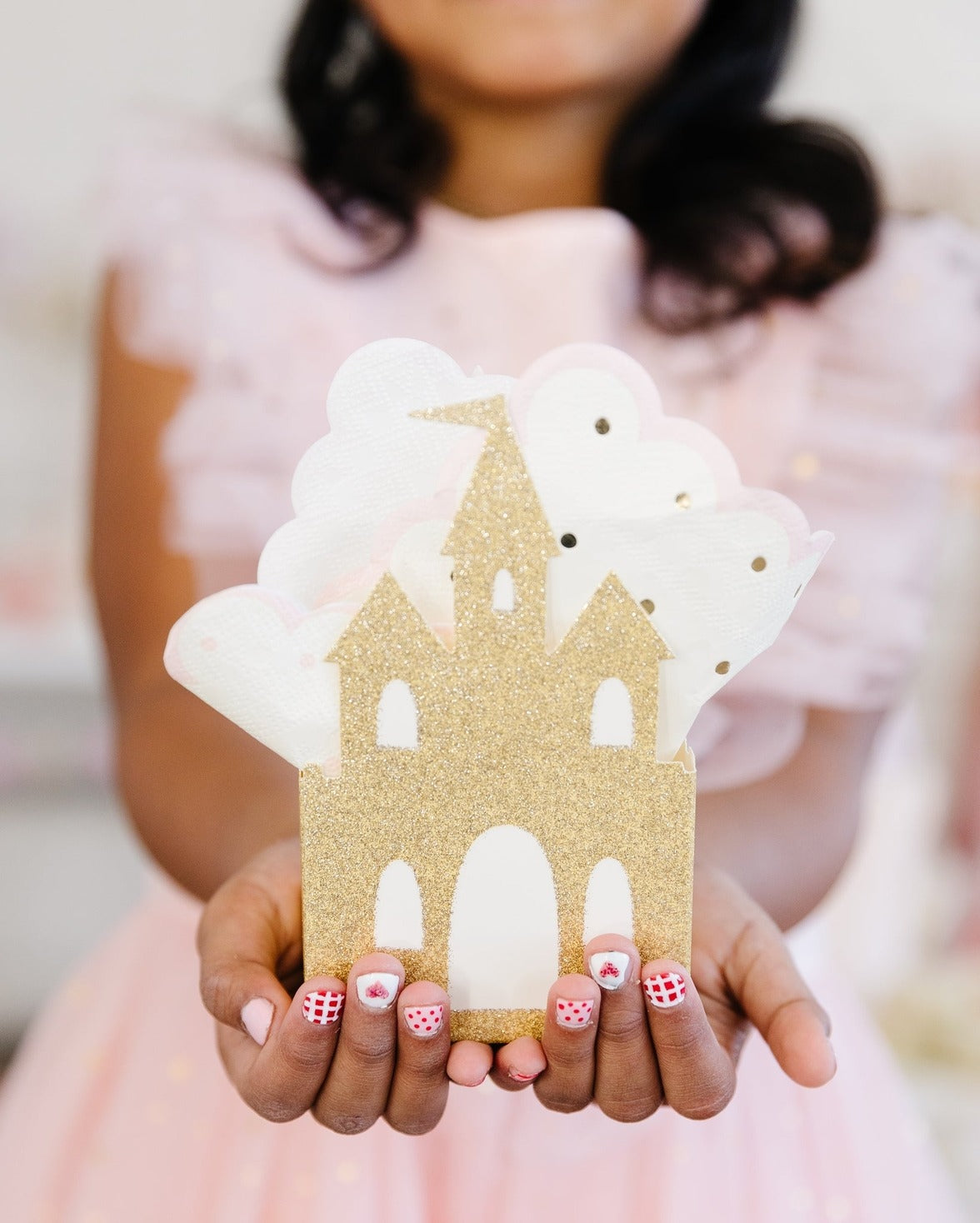 Gold castle napkin holder with white napkins princess birthday decor from Parte Haus party supply store in Bethesda MD