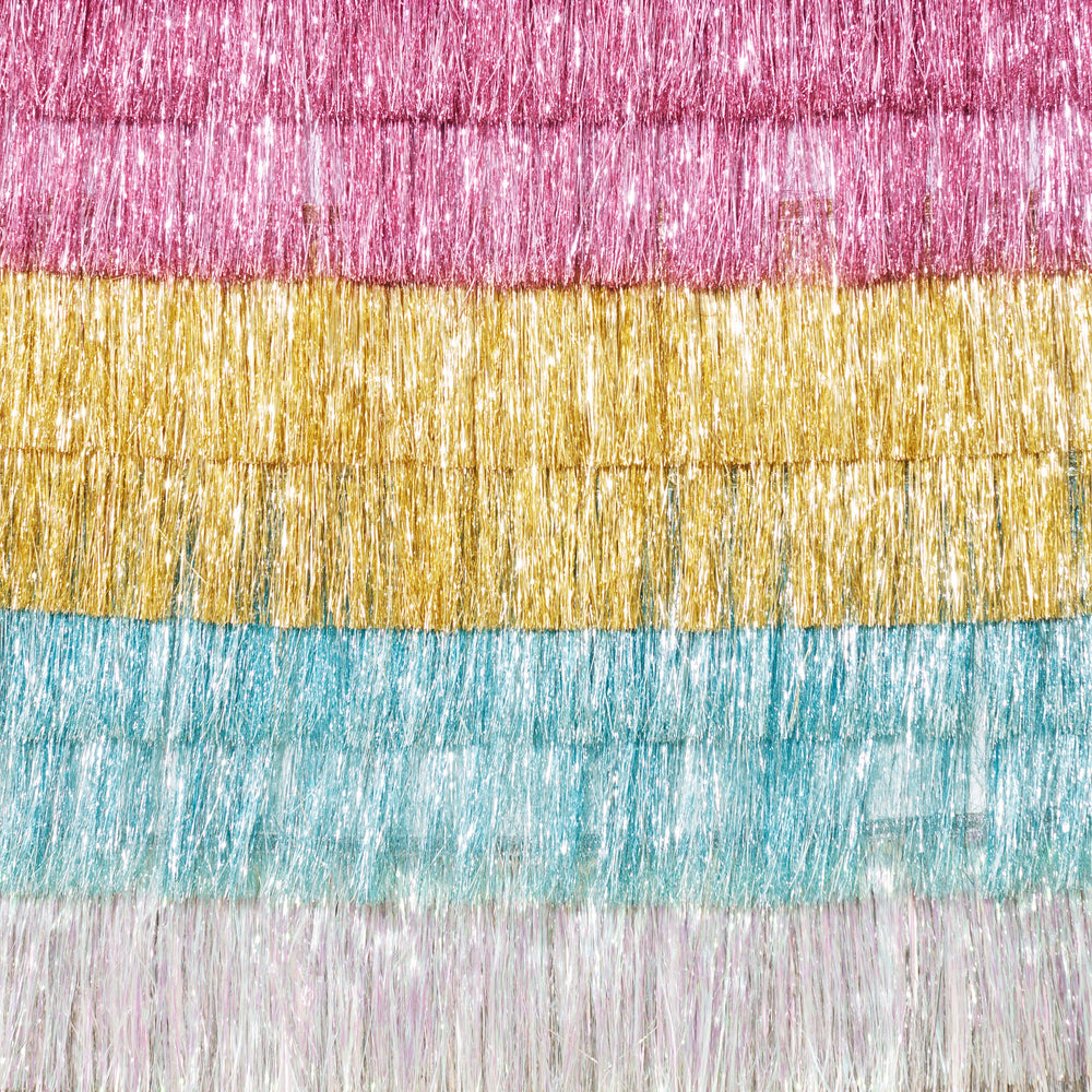 Pink gold blue and white fringe garland with metallic shine for birthday from Parte Haus party supply store in Bethesda MD