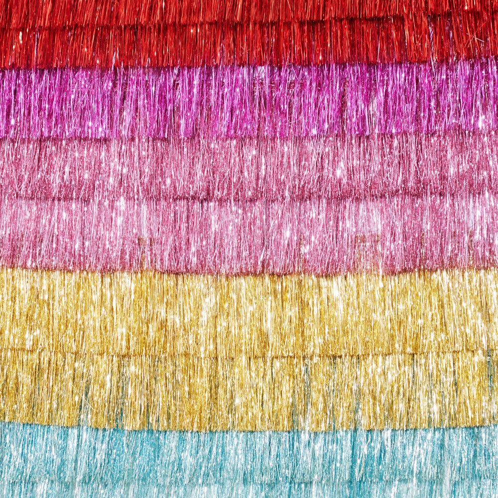 Rainbow metallic fringe backdrop decoration for birthday from Parte Haus party supply store in Bethesda Maryland