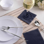 Navy blue napkins and white plates elegant table setting for dinner event from Parte Haus party supply store in Bethesda Maryland