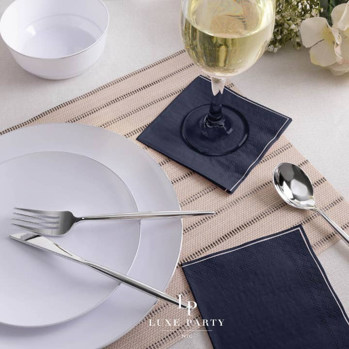 Navy blue napkins and white plates elegant table setting for dinner event from Parte Haus party supply store in Bethesda Maryland
