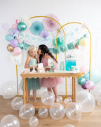 Pastel mermaid birthday backdrop with balloons and decorations from Parte Haus party supply store in Bethesda Maryland