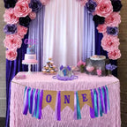 Purple first birthday banner and crown set with pink and purple flowers for girl from Parte Haus party supply store in Bethesda MD