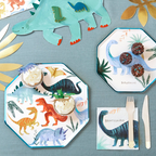 Colorful dinosaur birthday plates and napkins on table from Parte Haus party supply store in Bethesda MD