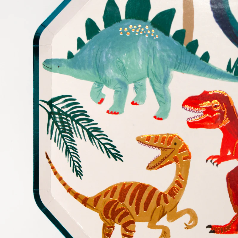 green and gold dinosaur plate featuring colorful dinosaur designs for dinosaur birthday from Parte Haus party supply store in Bethesda MD
