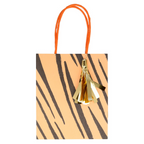 Orange tiger stripe gift bag with gold tassel for birthday from Parte Haus party supply store in Bethesda MD
