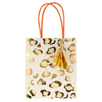 Gold leopard print gift bag with orange handles and tassel birthday celebration from Parte Haus party supply store in Bethesda Maryland