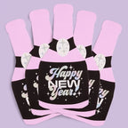 Pink champagne bottle shaped napkins with Happy New Year text for New Year's Eve from Parte Haus party supply store in Bethesda MD