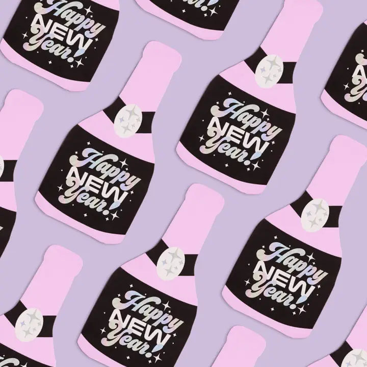 Pink champagne bottle napkins with Happy New Year text New Year's Eve theme from Parte Haus party supply store in Bethesda MD