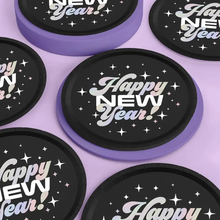Black and purple Happy New Year plates with disco star design New Year theme from Parte Haus party supply store in Bethesda Maryland