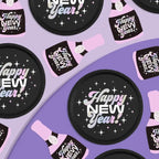 Black pink New Year plates and champagne bottle napkins disco theme from Parte Haus party supply store in Bethesda Maryland.