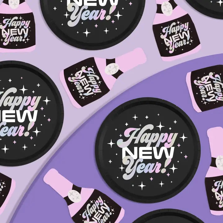 Black pink New Year plates and champagne bottle napkins disco theme from Parte Haus party supply store in Bethesda Maryland.