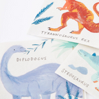 Colorful dinosaur napkins with illustrated diplodocus stegosaurus and t rex birthday from Parte Haus party supply store in Bethesda Maryland