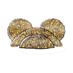 Gold glitter masquerade mask with feathers for celebration from Parte Haus party supply store in Bethesda MD