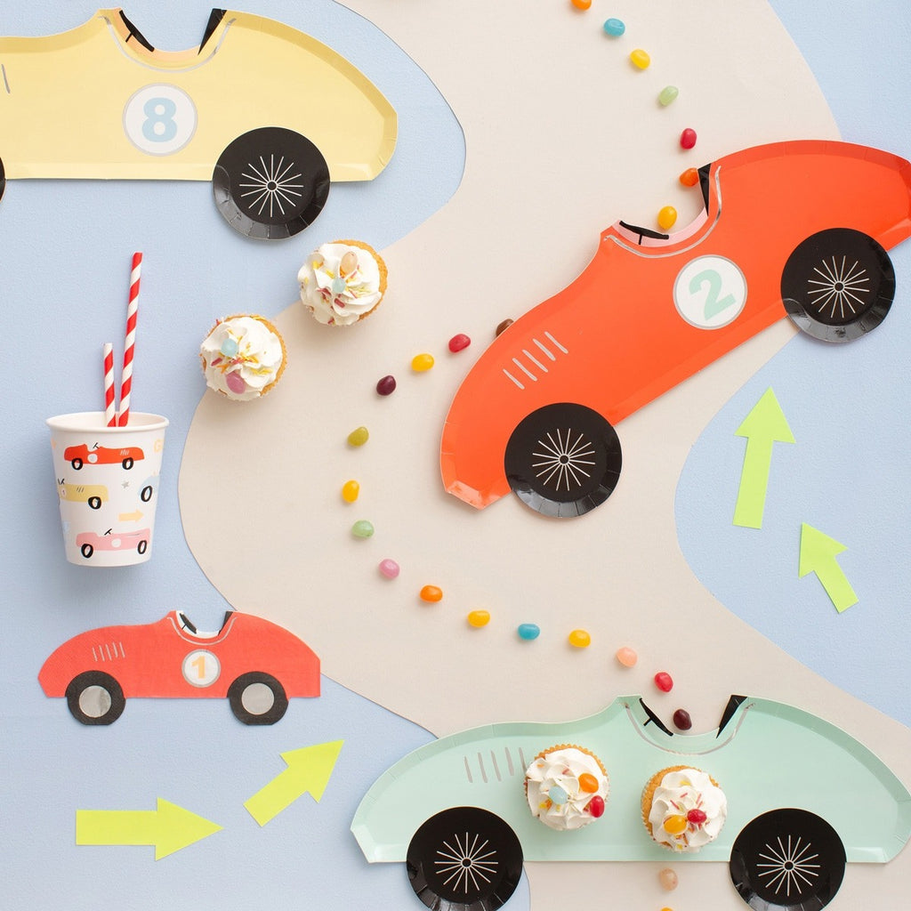 Yellow red mint race car shaped plates with matching cups for kids birthday theme from Parte Haus party supply store in Bethesda MD