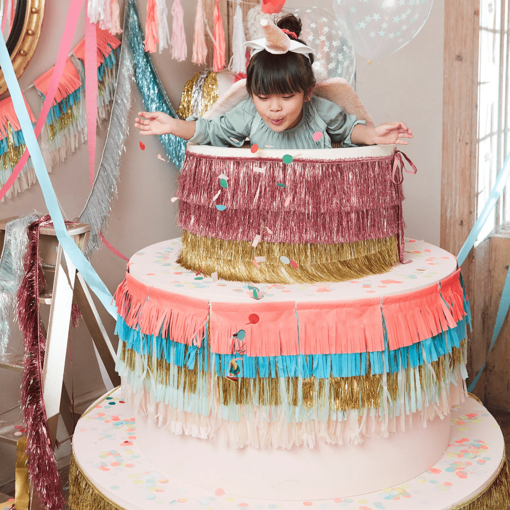 Pink and gold giant cake prop with fringe and confetti birthday theme from Parte Haus party supply store in Bethesda Maryland