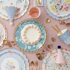 Blue and pastel floral tableware with cake and party hats birthday celebration from Parte Haus party supply store in Bethesda MD