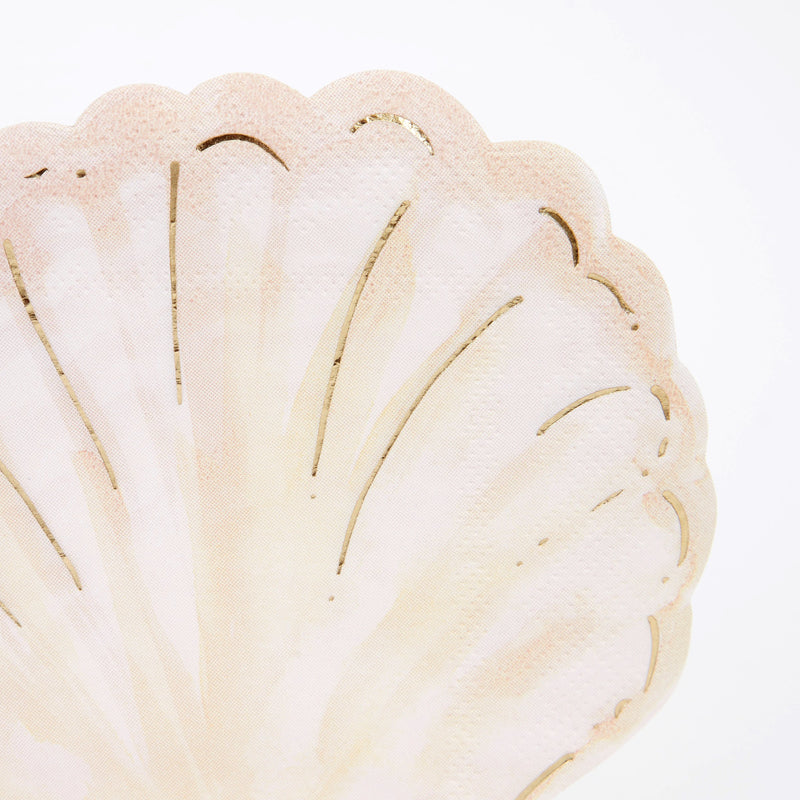 Beige shell shaped napkin with gold accents for ocean theme from Parte Haus party supply store in Bethesda Maryland