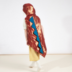 Brown dinosaur cape costume with blue spikes for birthday from Parte Haus party supply store in Bethesda Maryland
