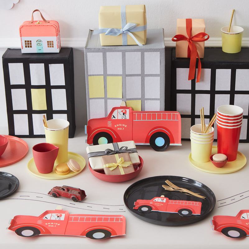 Red fire truck plates firefighter birthday table decor from Parte Haus party supply store in Bethesda Maryland