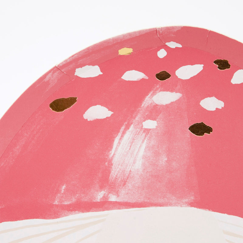 Pink mushroom shaped plate with white and gold spots woodland theme from Parte Haus party supply store in Bethesda MD.