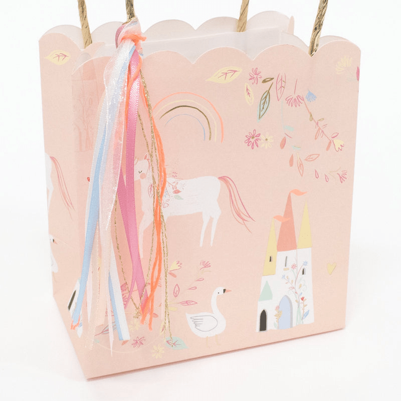 Pink unicorn gift bag with rainbow ribbons fairy tale birthday from Parte Haus party supply store in Bethesda MD.